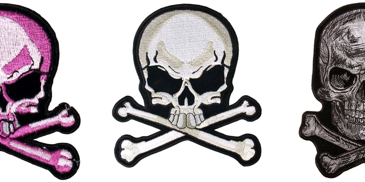 Embroidered skull patches arranged on a black leather motorcycle vest
